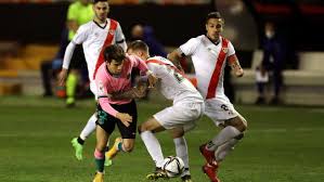 Barcelona secures two late goals to beat struggling rayo vallecano in a remarkable game and extend their lead at the top of la liga. 2wskuott Xnpkm