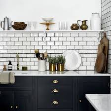 Grey glass subway tile kitchen backsplash with white cabinets. 19 Ways To Use Subway Tile In The Kitchen