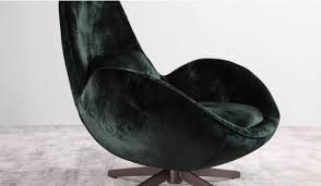 This design armchair is formed by an interior structure of fiberglass upholstered in velvet and filled with high density foam. Skal Swivel Velvet Armchair Delux Deco