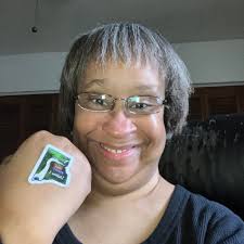 Picture from the late 1970's in the library at the faculty Christmas  brunch. On the left is Ethel Tripple, math teacher, getting punch is Asst.  Principal Dominic Sagolla