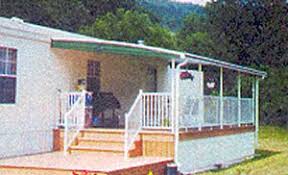 Our entire line of standard mobile home carports and patio covers are engineered to hold up to 2 1/2' of fluffy snow or 8 of compacted wet snow. Kibble Protector Products Awning Seamless Gutter Mobile Home Roof Products Carport