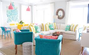 The turquoise coffee table with a natural wood top has wicker baskets for style and storage. House Of Turquoise