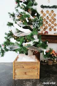 This Diy Christmas Tree Stand Makes Your Fake Fir Look Real And Taller Christmas Tree Stand Diy Christmas Tree Stand Fake Christmas Trees