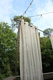 Alternatively, you can loop curtains through coat hooks and wooden knobs. Diy Floating Outdoor Curtain Rod Creating A Privacy Curtains For Deck