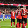 Thrilling 3-3 Draw Sees Austria and Algeria Advance to World Cup Knockout Stage