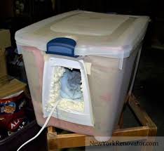 Cat enclosures can help keep your feline companions happy, healthy, and safe. Build A Cozy Low Cost Cat Shelter For Outdoor Cats Nested Storage Bins With Insulation Between Outside Cat Shelter Cat House Diy Outdoor Cat House