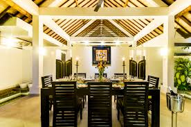 Contemporary modern dining table and chairs kitchen dining room table set with wood legs and upholstered seat. Villa Noa Seminyak Bali Indonesia
