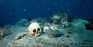 Haunting pictures show underwater graveyard beneath tropical paradise with  human skulls and abandoned belongings