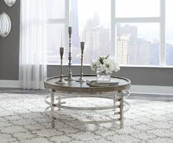 The unique grilled shelf and range of tones within the tiles bring the outdoors into the warm. Ashley Zinelli Gray Round Cocktail Table On Sale At Lakeland Furniture Mattress Serving Antigo Minocqua And Rhinelander Wi