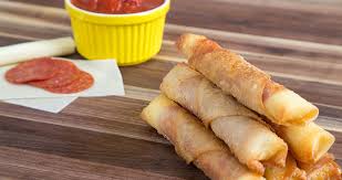 She Lays Cheese And Pepperoni On This Now Watch When She Starts Rolling Recipe Food Recipes Fried Pizza Sticks