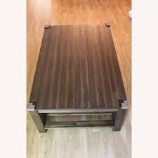 Combining sleek metal lines with the natural richness and glow of solid acacia, this coffee table offers beauty in addition to functionality. Macy S Coffee Table Aptdeco