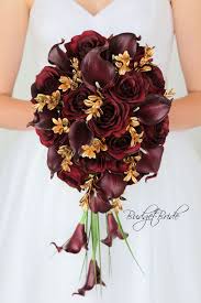 Maybe you would like to learn more about one of these? Wine And Gold Cascading Davids Bridal Wedding Flowers Burgundy Real Touch Calla Lilies Gold Wedding Flowers Red Wedding Flowers Wedding Flowers Bridal Bouquets