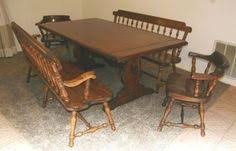 The round oak table rests on four iron legs. 39 Ethan Allen Furniture Ideas Ethan Allen Furniture Ethan Allen Furniture