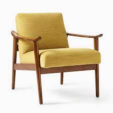 To keep things classic, coordinate the finishes of the natural furniture in the living room. Mid Century Show Wood Chair