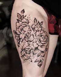Check out designpress for magical and enchanting platform wrist tattoo. Deathly Hallows Harry Potter Flowers Flower Thigh Tattoos Thigh Tattoo Designs Cute Tattoos