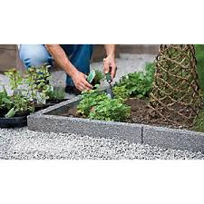 Coated in green plastic for extra durability, it's easy to install and the colour helps it to blend in with grass and leaves. Garden Edging Stones B Q