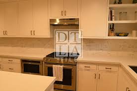 A glass tile backsplash in your kitchen or bathroom announces itself with shimmering light and rich colors. Santa Monica Carrara White Kitchen Backsplash Downtown Los Angeles Tile Contractor