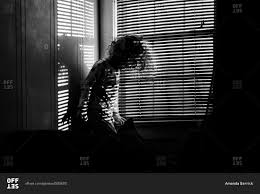 If you wish to maximize the level of privacy in your home, layering curtains and blinds is a wise decision. Child In Sunlight Through Window Blinds Stock Photo Offset