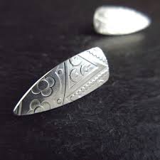 Maybe you would like to learn more about one of these? Bullet Shape Sterling Silver Stud Earrings With Embossed Pattern