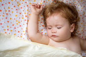 Within the discolored location on the sides and rear of your head. Portrait Of Little Attractive Lovely Sweet With Blonde Soft Curly Hair Cute Male Baby Boy Sleeping Indoor In Bed On Colorful Linen With Floral Pattern Horizontal Picture Stock Photo Picture And Royalty