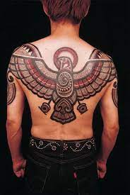 Aztec tattoos are popular today due to its beautiful patterns. Aztec Eagle Tattoo On Man Upper Back