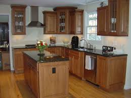 Maple Cabinets With Black Countertops Maple Kitchen Cabinets Kitchen Cabinets And Countertops Outdoor Kitchen Cabinets