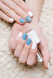Everything gets a new start in spring. Beautiful Female Hand With White And Blue Nail Design Holding Stock Photo Picture And Royalty Free Image Image 83542810