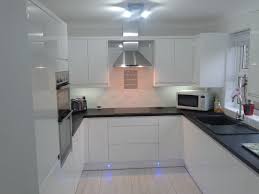 wren kitchens: handleless white gloss