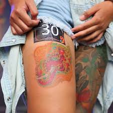 Elephant with flowers shoulder tattoo. Elephant Tattoos What Do They Mean Spiritually Worldwide