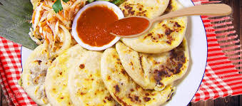 Salvadorian women typically greet each other with a pat on the right forearm or shoulder instead of shaking the pupusa is the most popular of salvadorian foods, consisting of thick corn or rice flour tortilla, with cheese and pork. National Dish Of El Salvador Pupusa National Dishes Of The World
