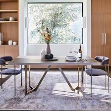 Each leg tapers down towards the bottom. Tower Dining Table Concrete Concrete Dining Table Dining Table Expandable Dining Table