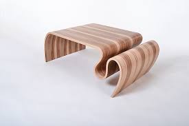The rectangular table is made from solid mango wood and is supported by four hairpin legs with a gold finish for some retro vibes. Large Crazy Carpet Table By Kino Guerin Wood Coffee Table Artful Home