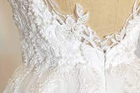 Mark this area with a pin, and pin one of the bustle loops to the dress. Wedding Dress Lace Overlay Before And After Heili Bridal