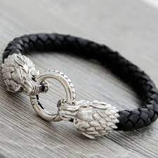 silver wolf bracelet house stark jewelry wolf leather bracelet etsy in 2021 modern silver jewelry mens jewelry silver jewelry fashion