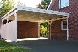 Ein Doppelcarport Aus Holz In Einem Zeitlosen Anstrich In Der Deckfarbe Weiss Zwei Autos Finden Unter Dem Flachdachcarpo Doppelcarport Carport Anbau Gartenhaus