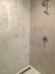 It looks terrific on the walls and the floor as well. Calcutta Polished Porcelain Discontinued Porcelain Tile Bathroom Bathroom Tile Designs Marble Tile Bathroom