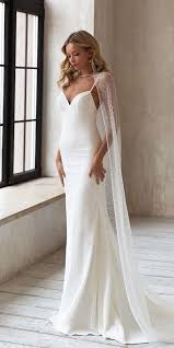 27 Awesome Simple Wedding Dresses For Cute Brides Wedding Dresses Guide In 2020 Wedding Dresses Simple Cape Wedding Dress Wedding Dress Guide