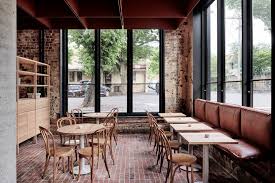 Red Brickwork In Melbourne S Bentwood Cafe Reflects The Industrial Heritage Of Its Surroundings Modern Interior Design Cafe Seating Cafe Design