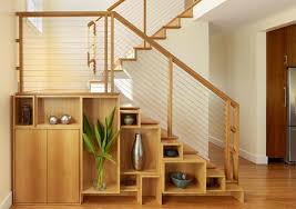 Stack shelves or a credenza under your stairs for a sleek look. 15 Ideas For Space Saving Under Staircase Shelves Home Design Lover