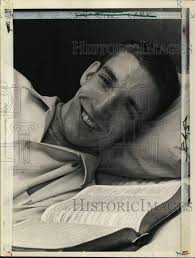 1965 Press Photo Brian Sternberg reads Bible in bed at home