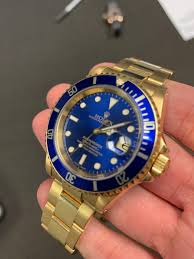 The oyster perpetual submariner date in 18 ct white gold with a cerachrom bezel insert in blue ceramic and a black dial with large luminescent hour markers. Rolex 16618 Submariner 18k Yellow Gold Blue Watch Review