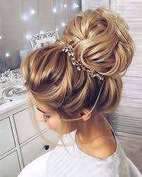 This Beautiful High Bun Wedding Hairstyle Perfect For Any Wedding Venue High Bun Wedding Hairstyles Hair Styles Elegant Wedding Hair