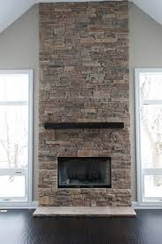 The tile features random strips of stacked stone glued this amber falls ledger natural quartzitethis amber falls ledger natural quartzite wall tile is the perfect. Ledge Stone Fireplaces Album 2 Traditional Living Room Chicago By Hx Home Solutions And North Star Stone Houzz