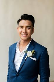 Groom In A Navy Blue Linen Suit With White Rose And Eucalyptus Boutonniere Linen Wedding Suit Navy Blue Linen Blue Linen Suit