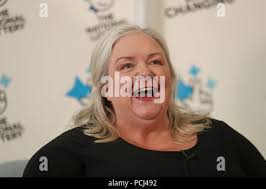Lesley Higgins, 57, from Laurencekirk, Aberdeenshire celebrates after  winning£57.9 million