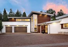 Garages aren't the most exciting part of a home. Stylish Garage Doors For The Modern Home