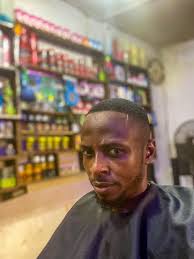 I see the side profile of a man with sunglasses. And a weird mustache  growing out of his nostril. 🤣