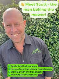 Proud homeowner admires lawn after mowing