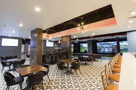 Here, at olympic golf zone, we have created the first sports bar with a virtual reality golf simulator, where, regardless of weather, the golf range is as green as ever. Olympic Golf Zone Buena Park Ca