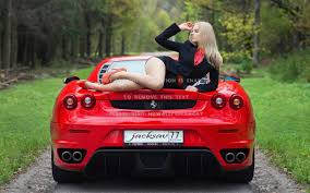 The ferrari sf90 stradale assetto fiorano has set the fastest lap recorded by a production car at the indianapolis motor speedway 3.925 km road course, lapping the circuit at an impressive 1:29.625 seconds at a maximum speed of 280.9 kmh to set this time. Model Posing On A Red Ferrari Car Blonde